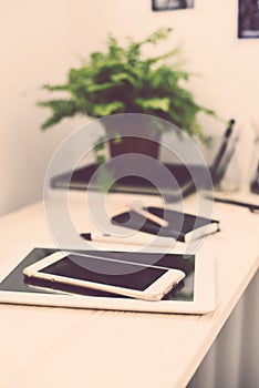 Tablet and smartphone on the working table