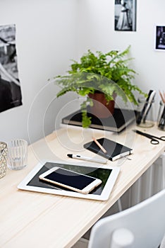 Tablet and smartphone on the working table