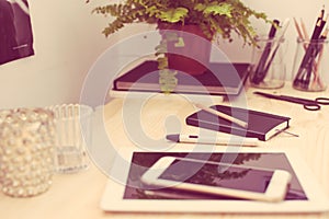 Tablet and smartphone on the working table