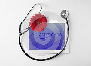 Tablet and stethoscope on white background. Gynecology concept