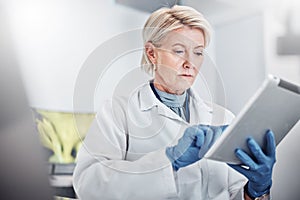 Tablet, thinking and science with a doctor woman at work in a lab for research, innovation or development. Healthcare