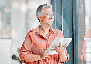 Tablet, thinking and senior business woman in office contemplating, research or internet browsing. Technology, ideas or