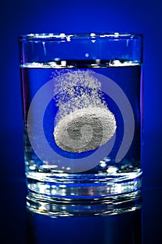 Tablet in a water glass