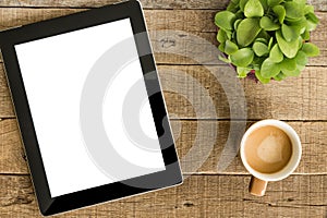 Tablet white screen display and coffee on table