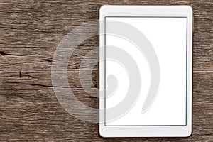 Tablet on wooden background