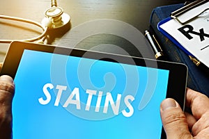 Tablet with word statins.