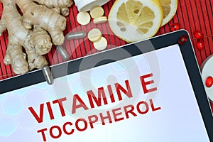 Tablet with words Tocopherol (vitamin E). photo