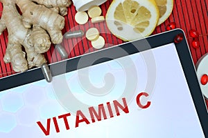 Tablet with words vitamin C. photo