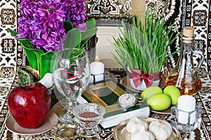 Tabletop with Haft-seen elements for Nowruz photo