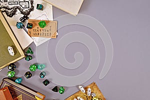 Tabletop roleplaying flat lay with RPG and game dices, rule book, notes and treasuremap