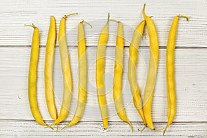 Tabletop view - yellow string wax beans on white boards