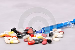 Tablets. Bottom full of pills accompanied by a syringe and a bottle. Fentanyl. USA