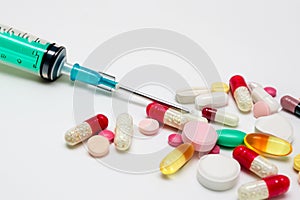 Tablets. Bottom full of pills accompanied by a syringe and a bottle. Fentanyl. USA