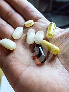 Tablets and drug capsule glucosamine and chondroitin in the palm of your hand