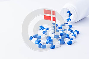 Tablets and the flag of Denmark. Import of tablets to Denmark.