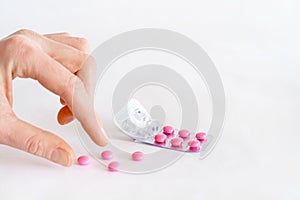 Tablets in hand on a white background close-up.