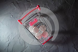 Tablets lie in a supermarket cart. Copy space