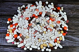 tablets, medical treatment with drugs concept, misuse and drug abuse concept, background of stack and pile of colorful medical