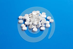 Tablets of Paracetamol on blue background