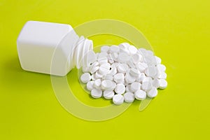 Tablets of Paracetamol on green background