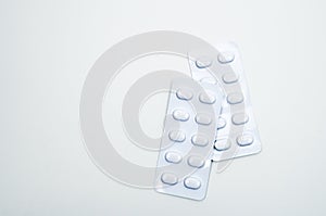 Tablets pill in white blister pack for light resistance packaging isolated on white background. Medicine for treatment