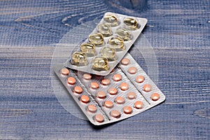 Tablets or pills in blisters. Drugs of pink and transparent