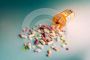 Tablets pills capsule heap mix therapy drugs, antidepressant, antibiotic, painkiller over a blue white background