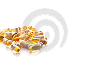 Tablets, pills, capsules, drugs pouring out of white bottle on white background. Sport, healthy lifestyle, medicine, nutritional