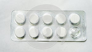 Tablets or pills in the packet on a isolated white background.