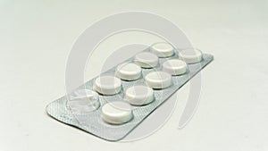 Tablets or pills in the packet on a isolated white background.