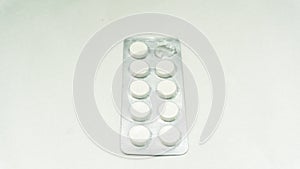 Tablets or pills in the packet on a  white background.