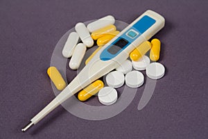 Tablets, pills and an thermometer