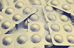 Tablets in silvery blisters close-up. Antibiotics of the pill. H