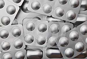 Tablets in silvery blisters close-up. Antibiotics of the pill. Health and medicine