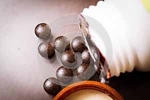 Tablets spilling out of a pill bottle. Pills out of a bottle