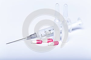 Tablets and syringes, ampoules injection on white background