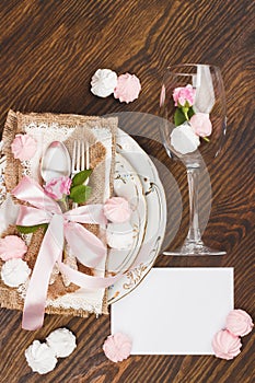 Tableware and silverware with puffy light pink roses