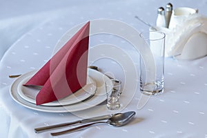 Tableware on a white tablecloth