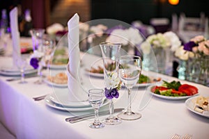 Tablewear and silverware closeup at wedding reception table