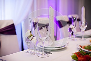 Tablewear and silverware closeup at wedding reception table elegant