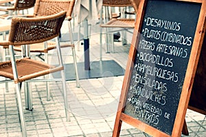 Tabloid with menu in a terrace