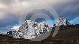 Taboche and Cholatse mountains and cloudy sky. Himalaya, Nepal