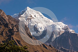 Taboche mountain peak in a morning. Snow mountain peak view from Tengboche village. Beautiful Himalaya mountains landscape in