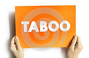 Taboo is a ban on something based in a cultural sensibility, sacred, or allowed only by certain persons, text concept on card photo