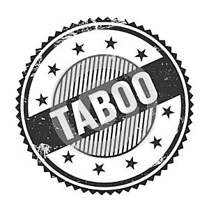 TABOO text written on black grungy round stamp