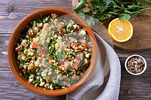 Tabouli Salad or Tabule, Tabbouleh - simple Mediterranean salad with vegetables and bulgur.