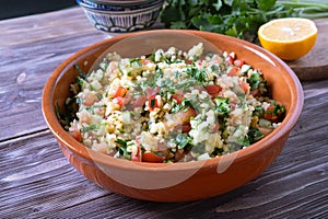 Tabouli Salad or Tabule, Tabbouleh - simple Mediterranean salad with vegetables and bulgur. photo