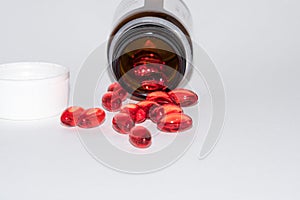 Tabs Vitamins, omega 3, Medications tablets and capsules in a beaker.