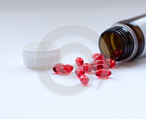 Tabs Vitamins, omega 3, Medications tablets and capsules in a beaker.