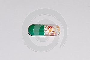 Tabs Vitamins, omega 3, Medications tablets and capsules in a beaker.